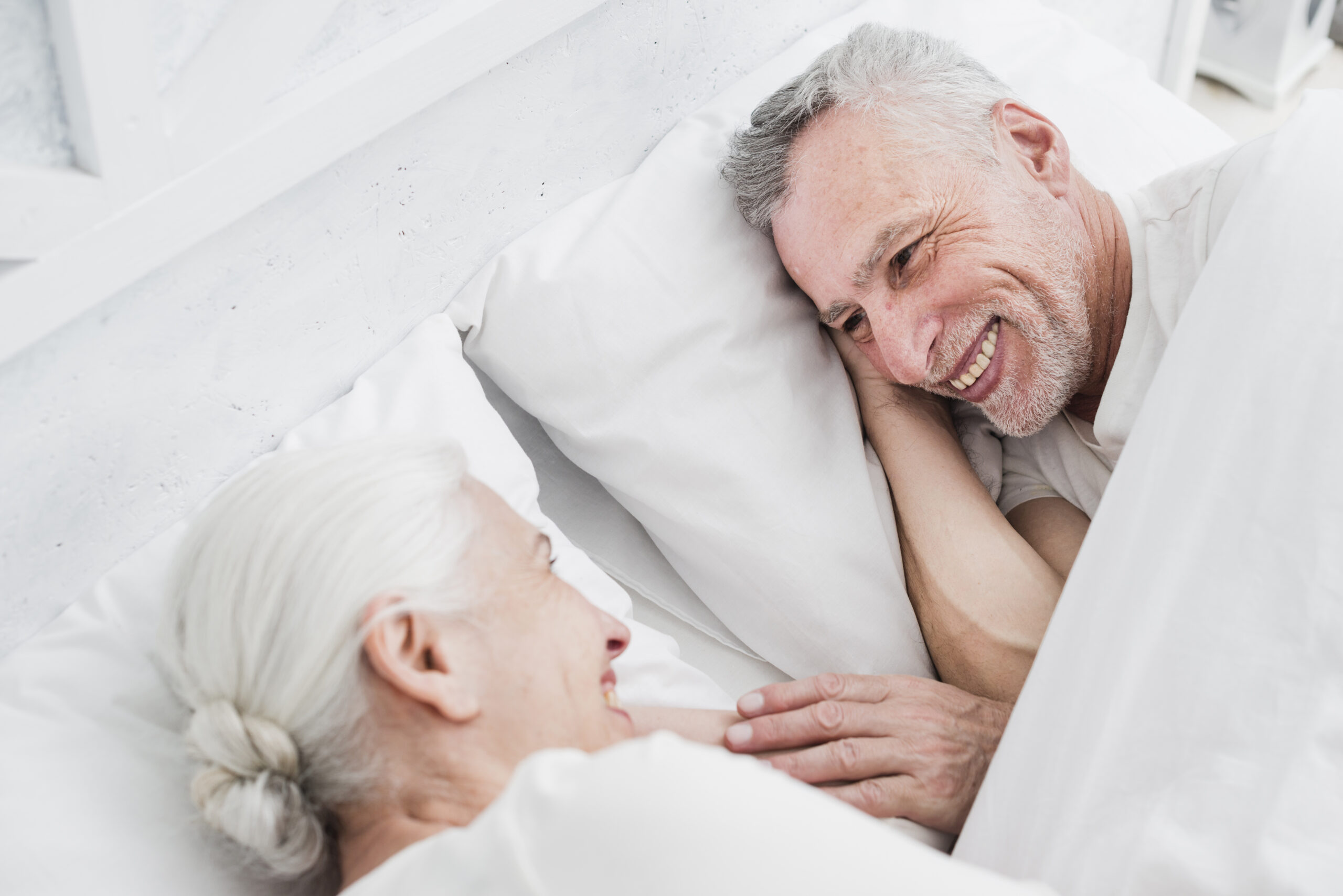 Happy couple in bed