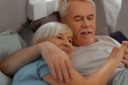 Happy couple in bed